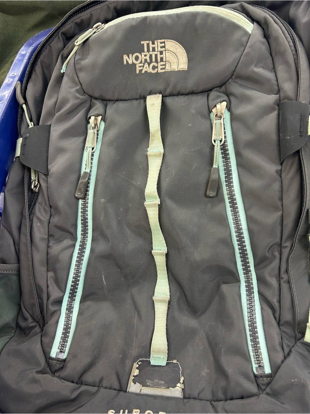 The North Face Black Backpack with Mint Accents surge 2 transit